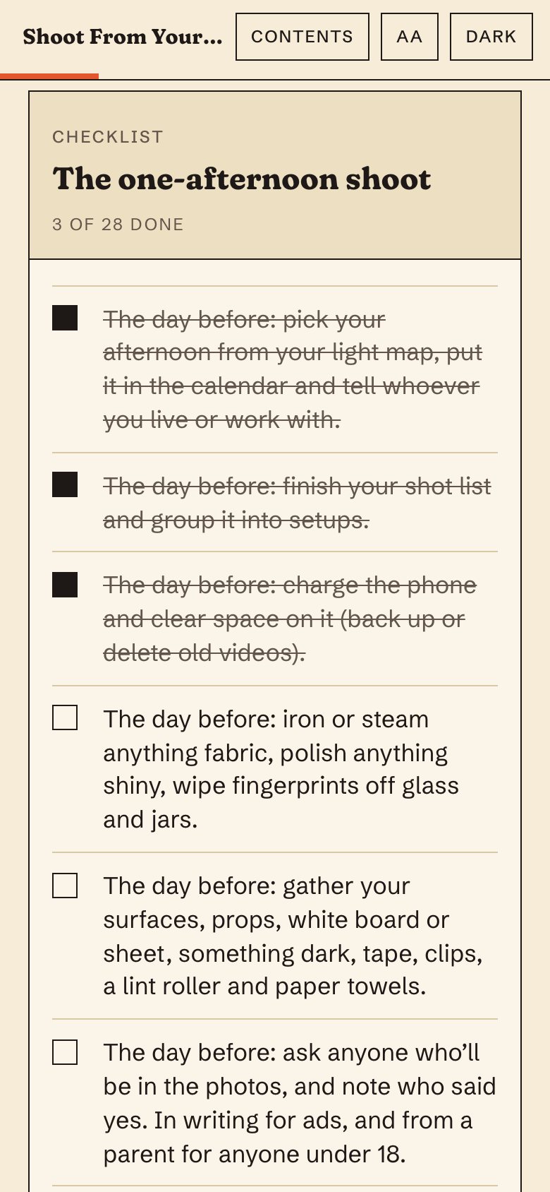 The one-afternoon shoot checklist in the web book, on a phone, with three items ticked.